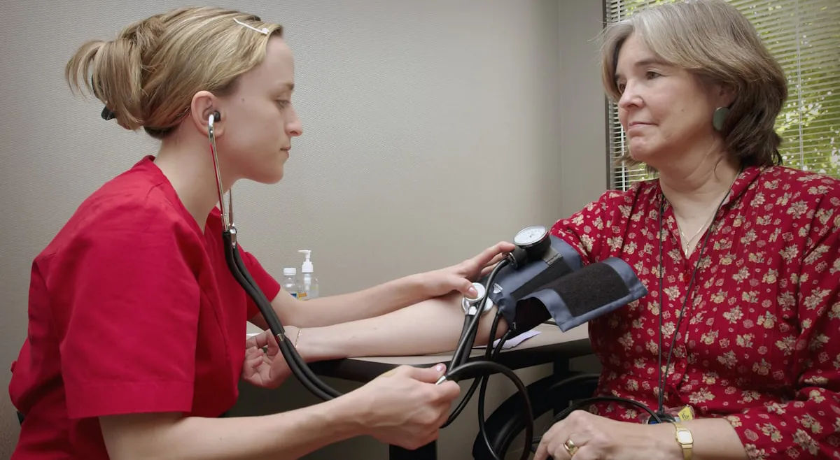 Hospice nurse documenting continuous home care hours during a symptom crisis