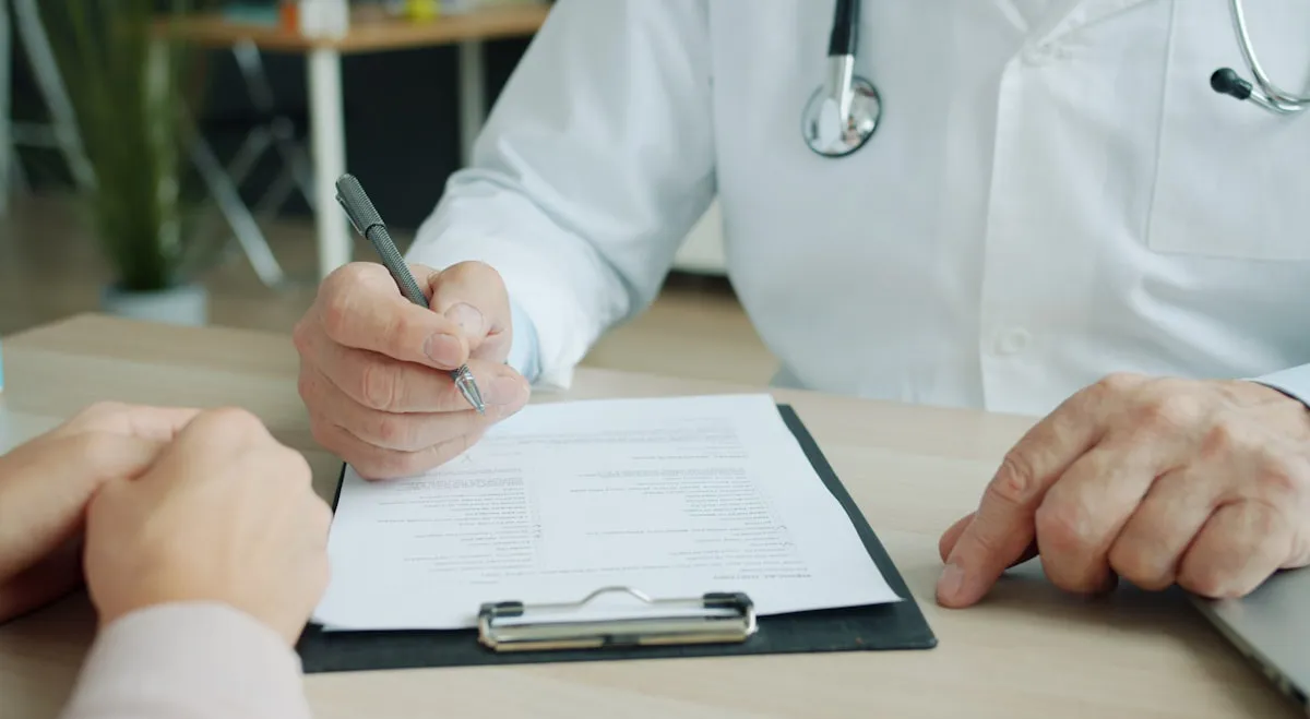 Hospice physician completing a recertification narrative ahead of a benefit period deadline